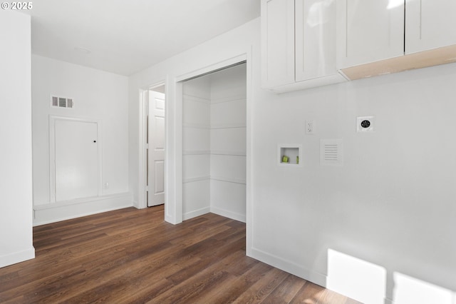 washroom featuring cabinets, washer hookup, dark hardwood / wood-style floors, and electric dryer hookup