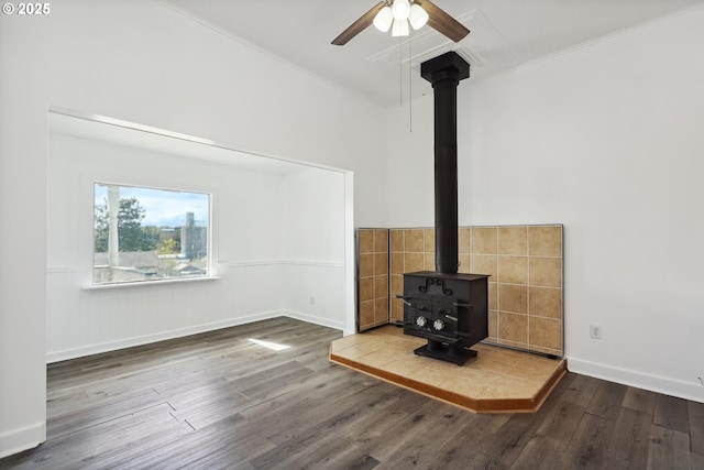 400 Mccoy St, Moro, OR 97039 - unfurnished living room with a wood stove, ornamental molding, wood finished floors, a wainscoted wall, and a ceiling fan