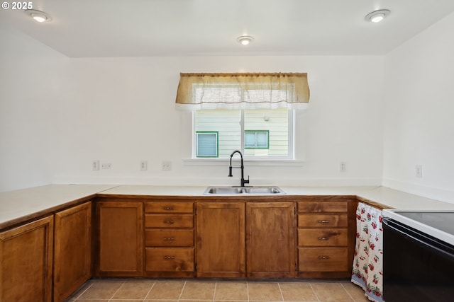 400 Mccoy St, Moro, OR 97039 - kitchen featuring a sink, light countertops, black range with electric cooktop, and brown cabinets