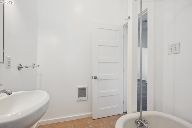 400 Mccoy St, Moro, OR 97039 - full bathroom featuring a sink, tile patterned flooring, baseboards, a freestanding tub, and heating unit