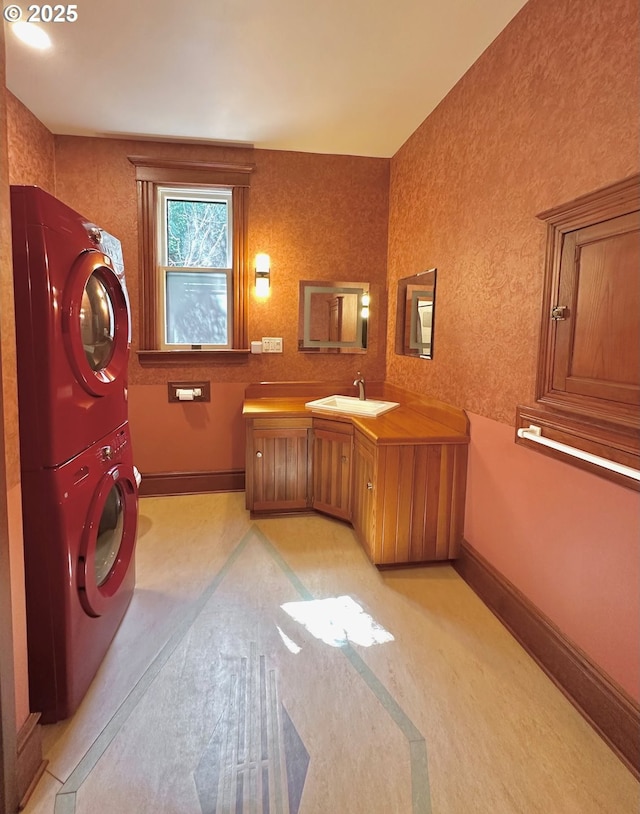 812 SW Saint Clair Ave Unit 3, Portland, OR 97205 - bathroom featuring stacked washer / drying machine, baseboards, and vanity