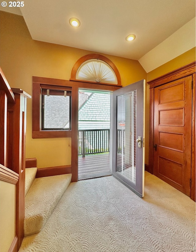 812 SW Saint Clair Ave Unit 3, Portland, OR 97205 - carpeted foyer featuring lofted ceiling and baseboards