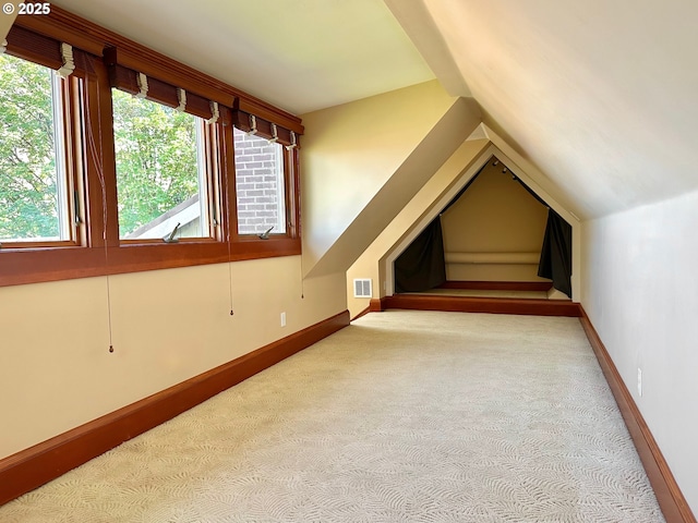 812 SW Saint Clair Ave Unit 3, Portland, OR 97205 - bonus room featuring carpet, baseboards, and vaulted ceiling