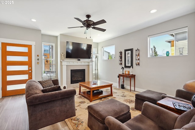 1250 29th St, Hood River, OR 97031 - living area with recessed lighting, ceiling fan, a glass covered fireplace, and light wood-style floors