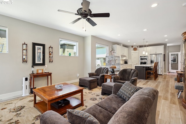 1250 29th St, Hood River, OR 97031 - living room with a ceiling fan, baseboards, recessed lighting, and light wood-type flooring