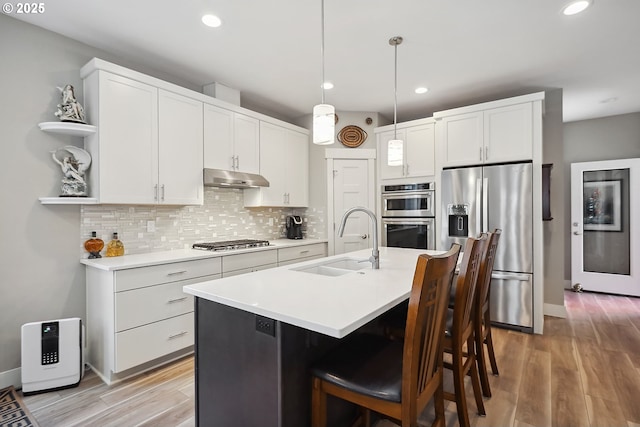 1250 29th St, Hood River, OR 97031 - kitchen featuring open shelves, light countertops, a sink, backsplash, and stainless steel appliances