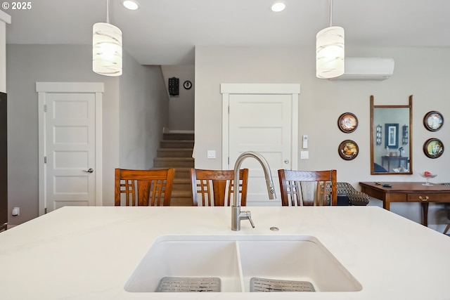 1250 29th St, Hood River, OR 97031 - kitchen featuring a wall mounted air conditioner, recessed lighting, light countertops, a sink, and hanging light fixtures