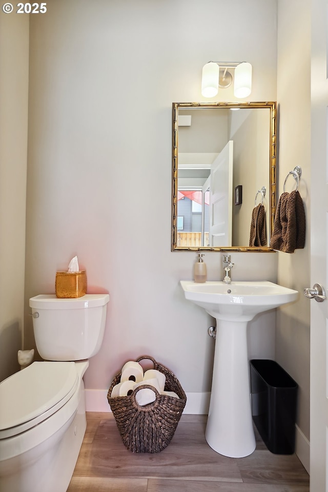 1250 29th St, Hood River, OR 97031 - bathroom with toilet, baseboards, and wood finished floors