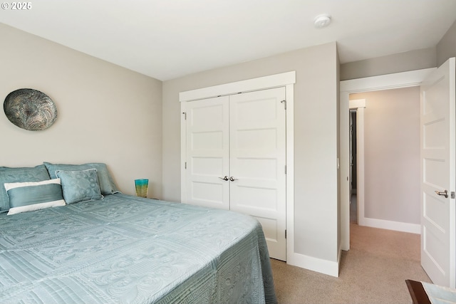 1250 29th St, Hood River, OR 97031 - bedroom with baseboards, a closet, and light carpet