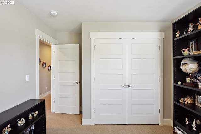 1250 29th St, Hood River, OR 97031 - bedroom featuring baseboards, light colored carpet, and a closet