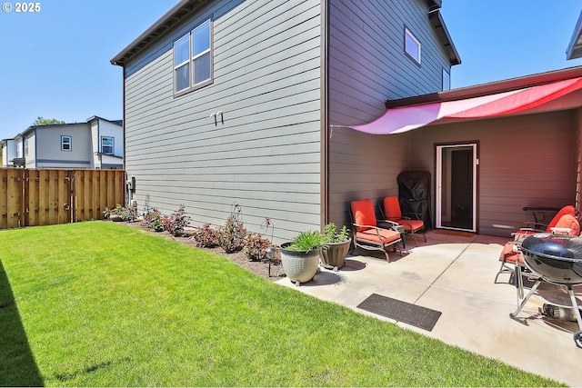 1250 29th St, Hood River, OR 97031 - back of property with a lawn, a patio area, and fence