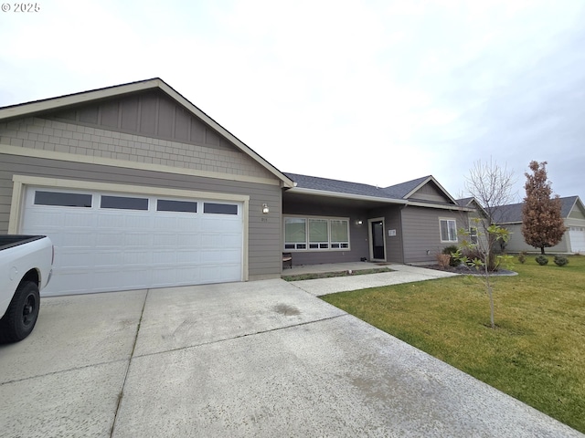 ranch-style home with a garage and a front yard