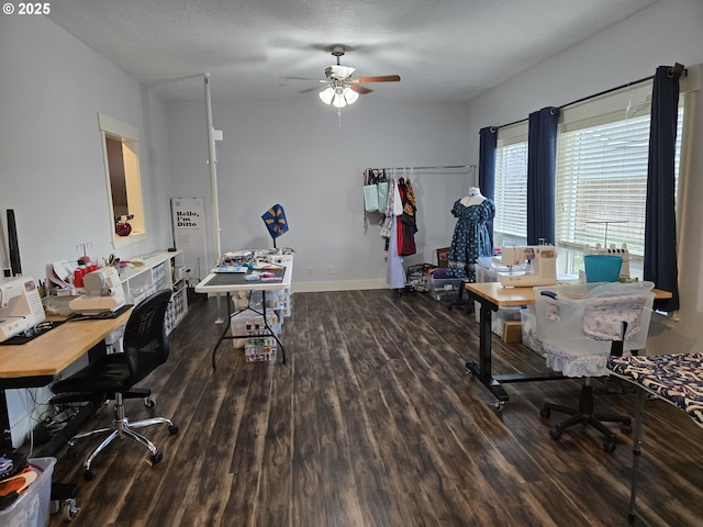 home office with ceiling fan and dark hardwood / wood-style floors