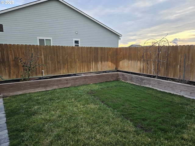 view of yard at dusk