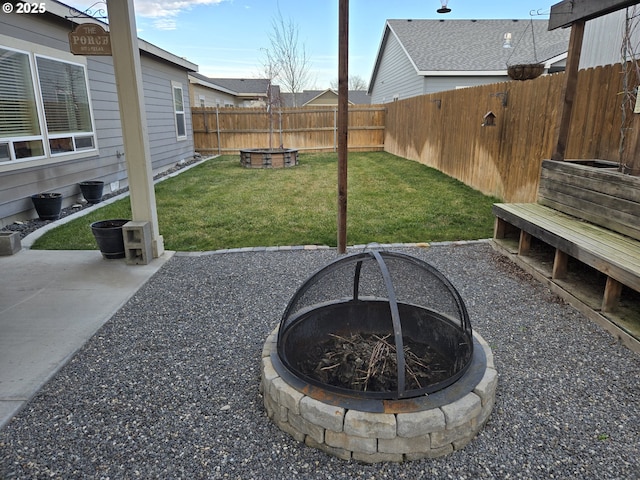 view of yard with an outdoor fire pit