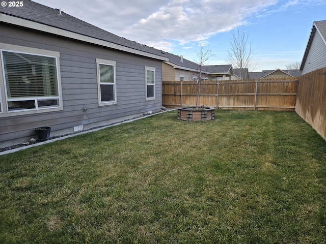 view of yard with an outdoor fire pit