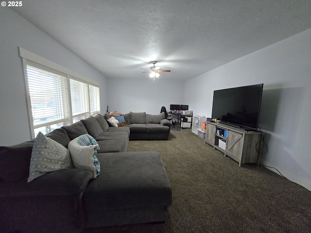 living room featuring a textured ceiling, ceiling fan, and carpet