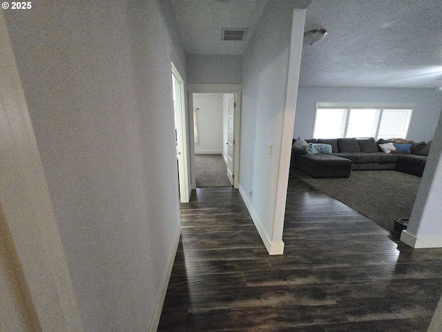 hallway with dark wood-type flooring