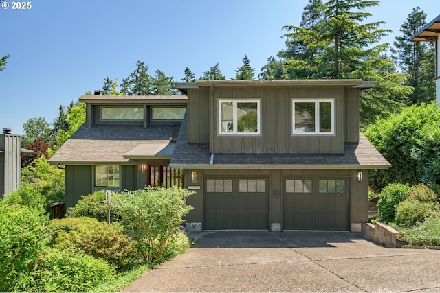 2965 Ingalls Way, Eugene, OR 97405 - view of front of house with board and batten siding, concrete driveway, a garage, and a shingled roof