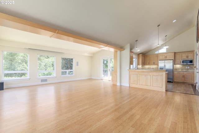 2965 Ingalls Way, Eugene, OR 97405 - unfurnished living room featuring light wood-style floors and vaulted ceiling