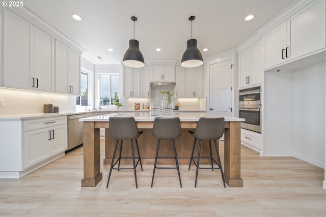 4300 N 12th Way, Ridgefield, WA 98642 - kitchen with stainless steel appliances, white cabinets, a center island, backsplash, and recessed lighting