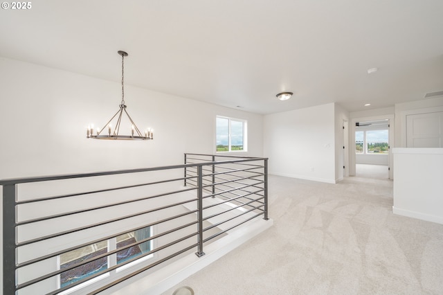4300 N 12th Way, Ridgefield, WA 98642 - hall featuring an upstairs landing, a chandelier, and light carpet