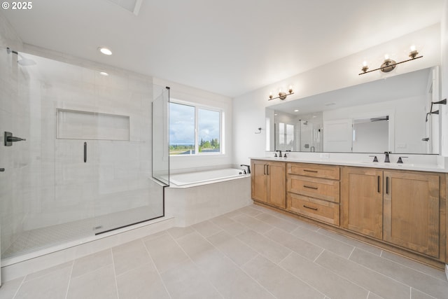 4300 N 12th Way, Ridgefield, WA 98642 - bathroom featuring a garden tub, double vanity, tile patterned flooring, a stall shower, and recessed lighting