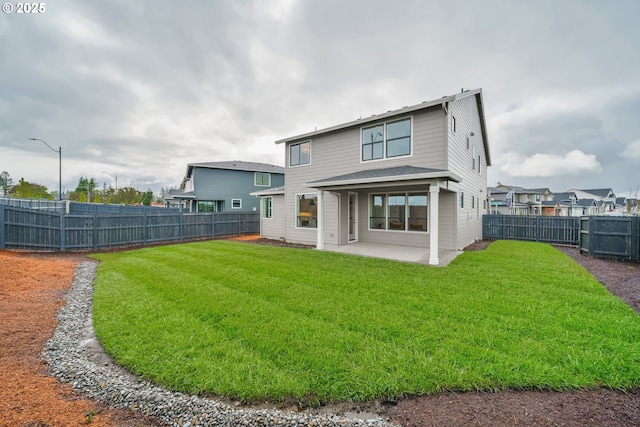 4300 N 12th Way, Ridgefield, WA 98642 - rear view of house with a patio area and a fenced backyard
