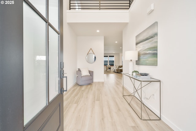 4300 N 12th Way, Ridgefield, WA 98642 - corridor featuring light wood finished floors, a towering ceiling, and recessed lighting