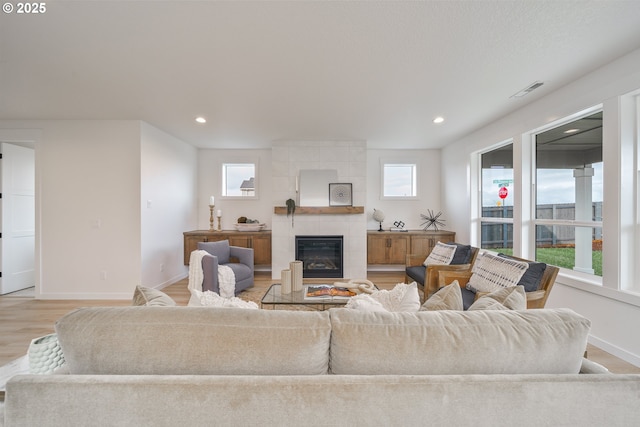 4300 N 12th Way, Ridgefield, WA 98642 - living area featuring light wood-type flooring, a fireplace, and recessed lighting