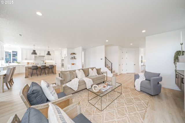 4300 N 12th Way, Ridgefield, WA 98642 - living room featuring light wood-type flooring, stairway, and recessed lighting