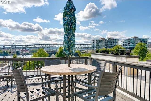 wooden deck with a water view