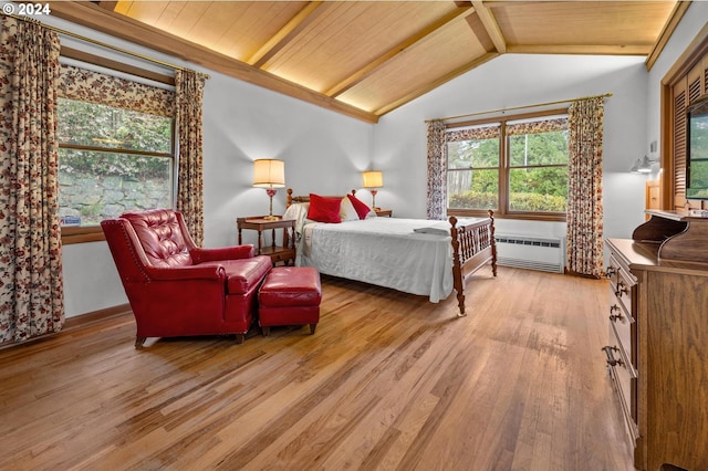 bedroom with lofted ceiling with beams, light hardwood / wood-style floors, radiator, and wood ceiling