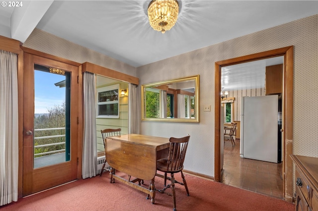 dining space with carpet floors