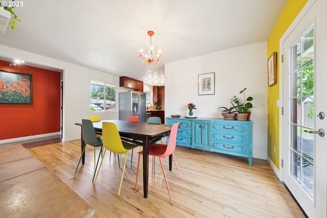 324 NE 108th Pl, Portland, OR 97220 - dining space with a chandelier and light wood-style floors
