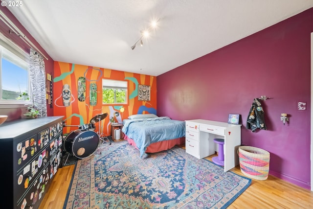 324 NE 108th Pl, Portland, OR 97220 - bedroom featuring wood finished floors and track lighting