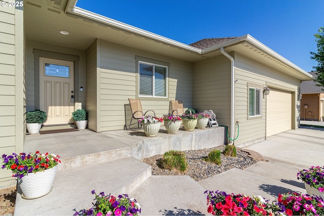 2260 NE 8th St, Hermiston, OR 97838 - view of exterior entry with an attached garage and driveway