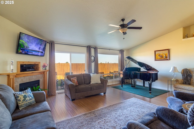 2260 NE 8th St, Hermiston, OR 97838 - living area with vaulted ceiling, ceiling fan, wood finished floors, and a fireplace