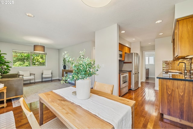 1912 SE 11th Ave Unit 3, Portland, OR 97214 - dining area with baseboards, recessed lighting, and hardwood / wood-style floors