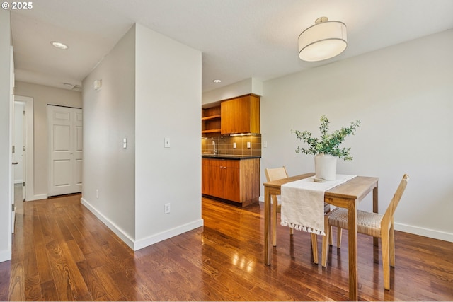 1912 SE 11th Ave Unit 3, Portland, OR 97214 - dining area with dark wood-style floors, baseboards, and recessed lighting