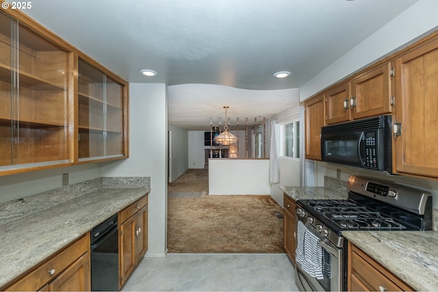 1912 Petty Grove Ct, Keizer, OR 97303 - kitchen featuring black microwave, gas stove, brown cabinets, recessed lighting, and light stone countertops