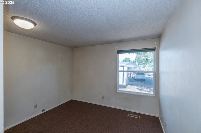 1912 Petty Grove Ct, Keizer, OR 97303 - unfurnished room featuring a textured ceiling, carpet flooring, and baseboards