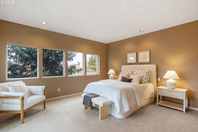 bedroom with recessed lighting, baseboards, and light carpet