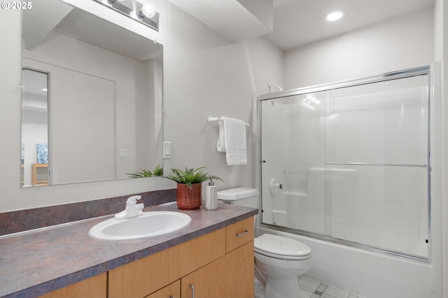 full bathroom with toilet, vanity, and shower / bath combination with glass door