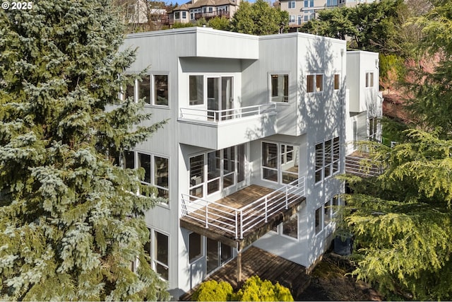 rear view of property featuring central AC