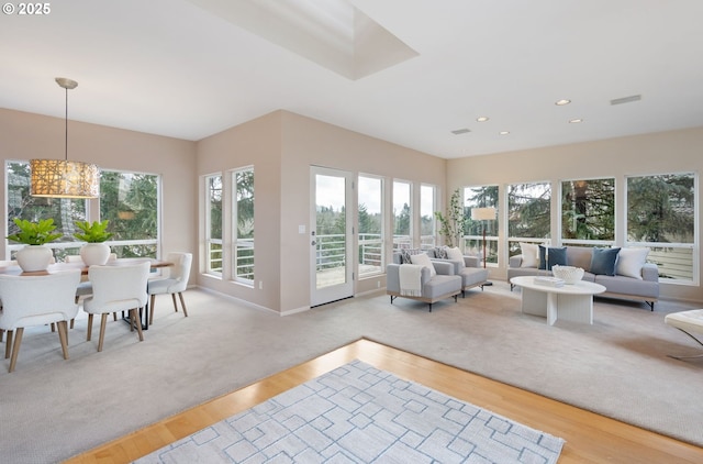 sunroom with a wealth of natural light and visible vents