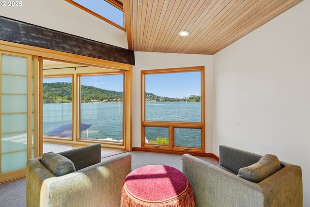 6901 SE Oaks Park Way Unit F, Portland, OR 97202 - carpeted living room with a water view, wood ceiling, healthy amount of natural light, vaulted ceiling, and recessed lighting