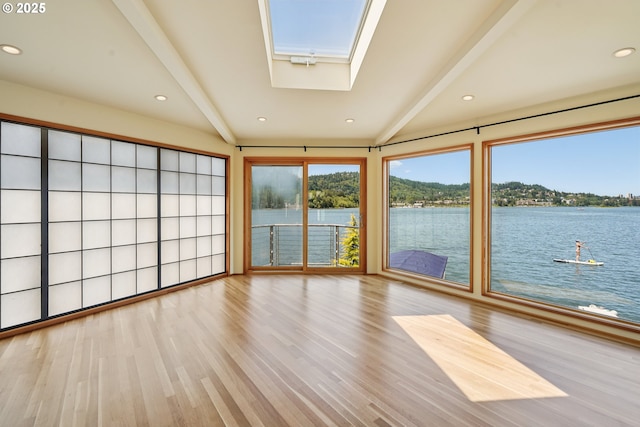 6901 SE Oaks Park Way Unit F, Portland, OR 97202 - unfurnished sunroom with a skylight, a water view, and beam ceiling