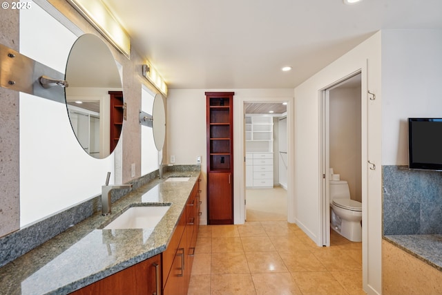 6901 SE Oaks Park Way Unit F, Portland, OR 97202 - bathroom with toilet, double vanity, recessed lighting, tile patterned flooring, and a walk in closet