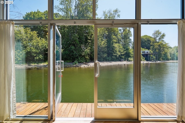 6901 SE Oaks Park Way Unit F, Portland, OR 97202 - entryway featuring a water view, view of wooded area, and plenty of natural light